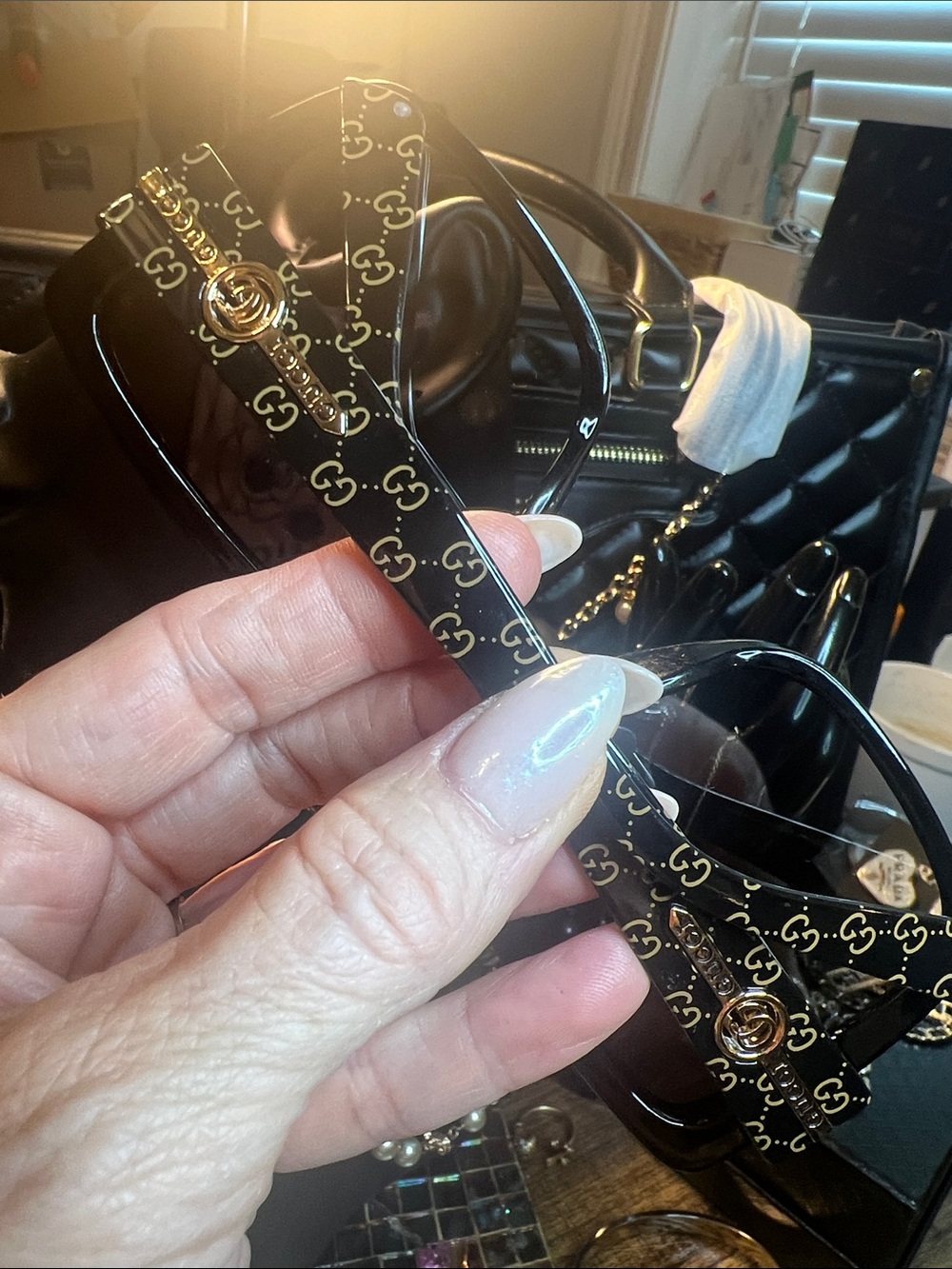 Black Sunglasses with Gold Logo Accents
